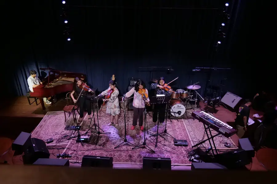 Prism students on stage and in class